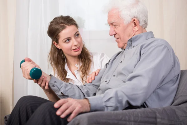 Senior man training with dumbbell — Stock Photo, Image