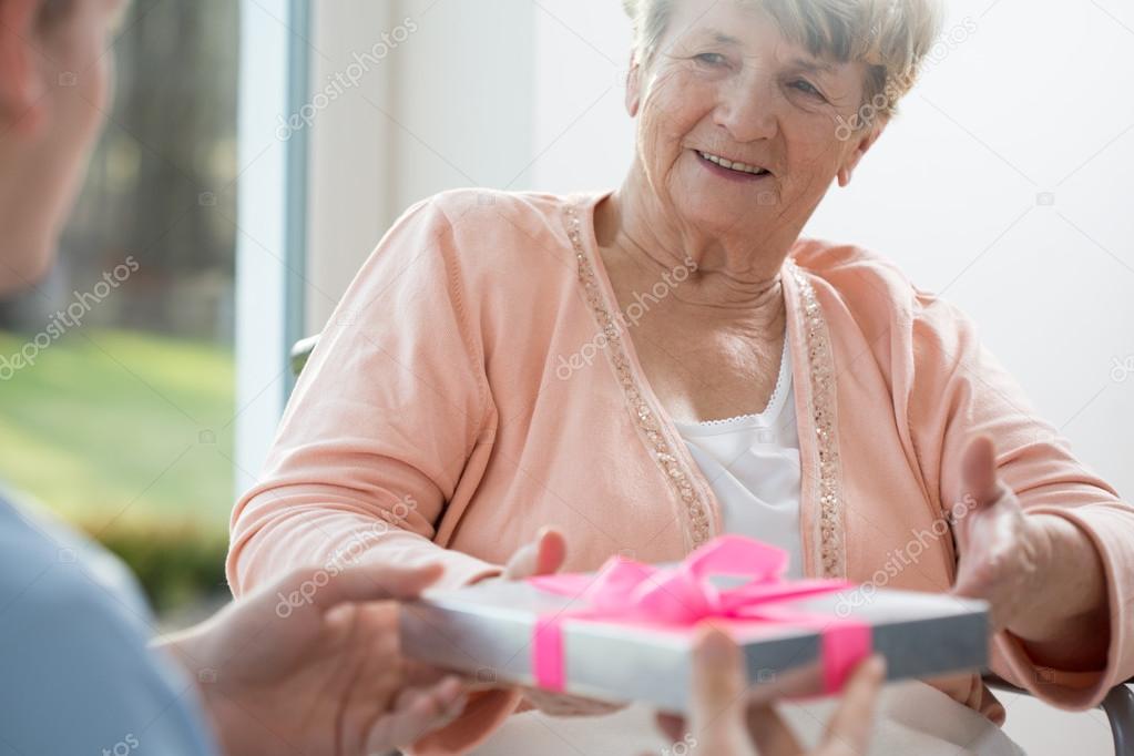 Old woman giving present