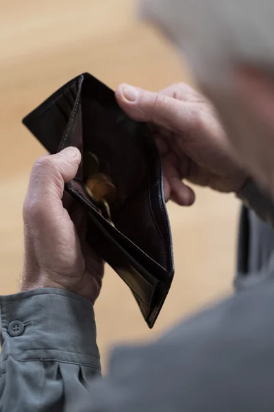 Senior man holding empty wallet — Stock Photo, Image