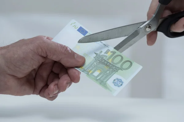 Cutting banknote — Stock Photo, Image