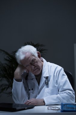 Experienced doctor suffering for depression clipart