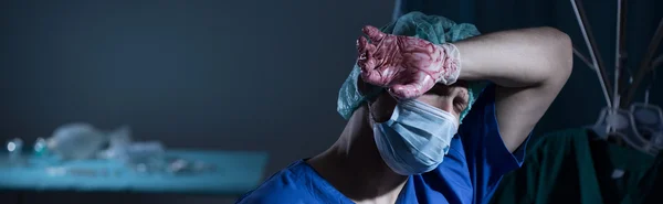 Surgeon being tired after operation — Stock Photo, Image