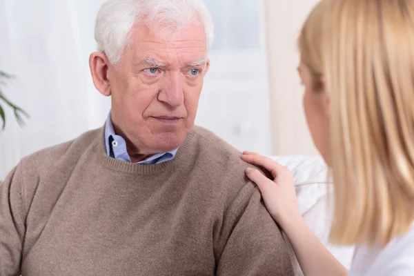 Grandpa supported by his granddaughter — Stock Photo, Image