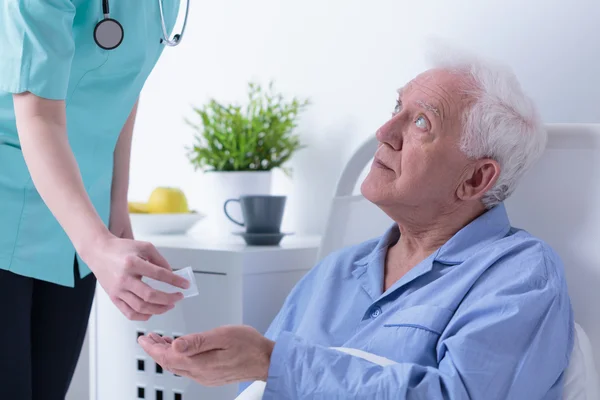 Retired man in hospital — Stock Photo, Image