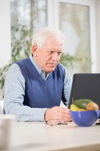 Focused man using laptop — Stock Photo, Image