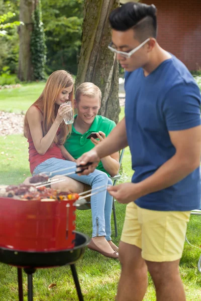 Asian man cooking — Stock Photo, Image