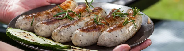 Grilled sausages in the garden — Stock Photo, Image