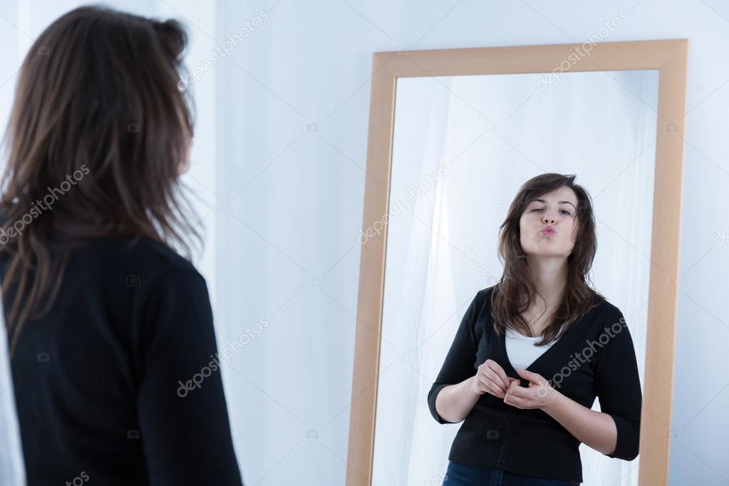 Girl in front of the mirror