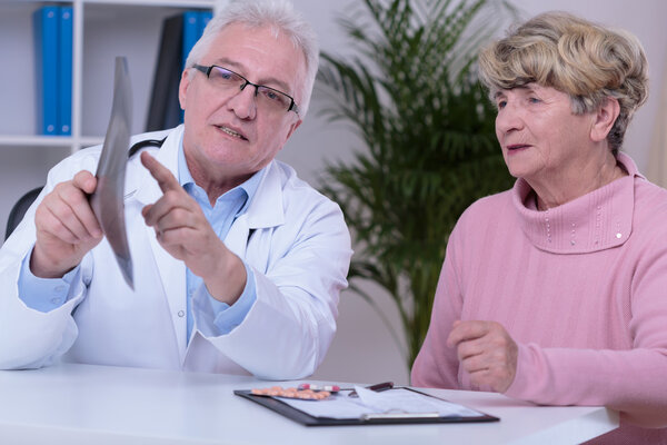 Doctor with patient in office