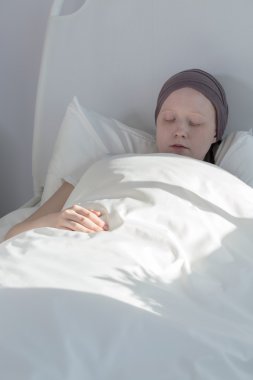 Cancer girl staying in bed clipart