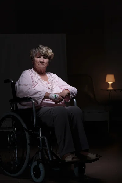 Lonely woman sitting on wheelchair — Stock Photo, Image