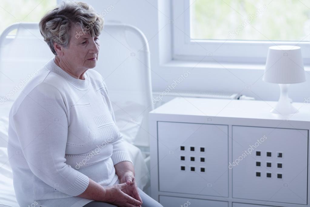 Retired woman in hospital room