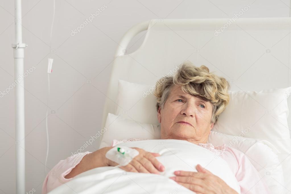 Aged woman with intravenous cannula