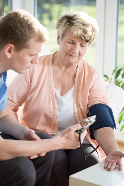 Taking blood pressure — Stock Photo, Image