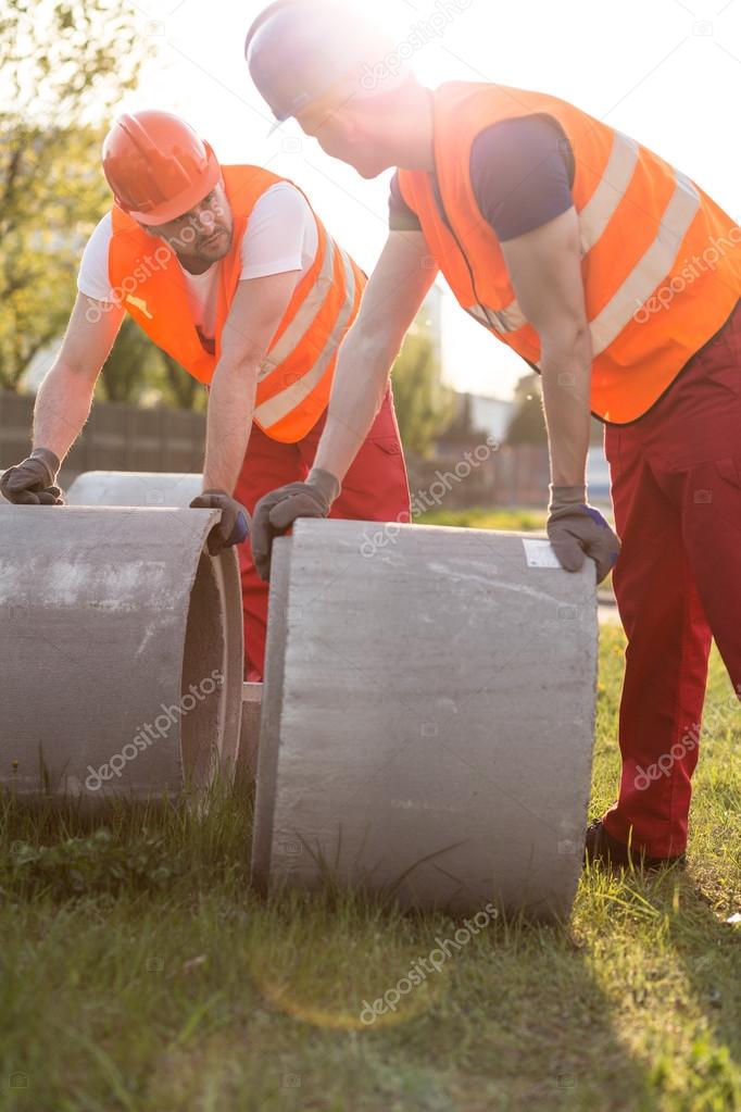 Builders and concrete pipes