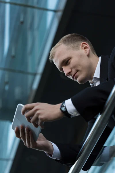 Businessman using tablet during break — Stock Photo, Image