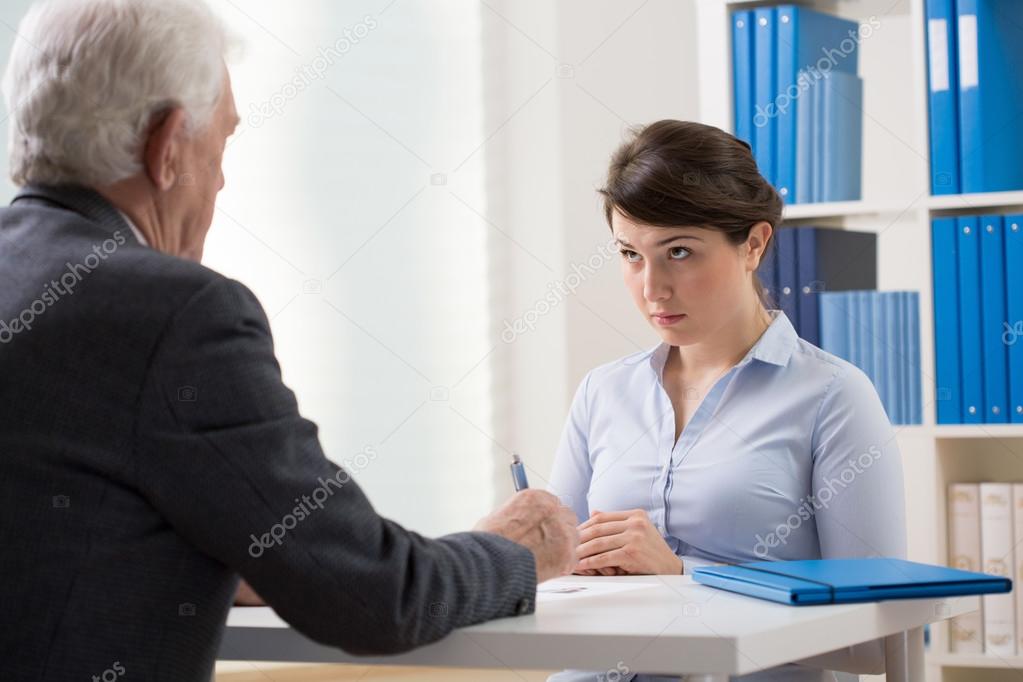 Young woman talking to a manager