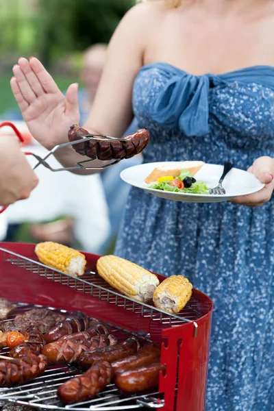 Woman being on diet refusing sausage — Stock Photo, Image