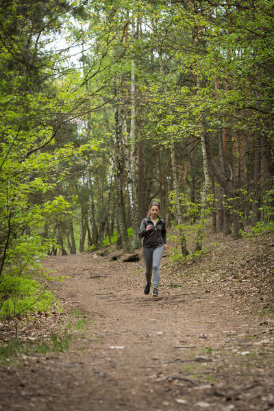 running woman in forest