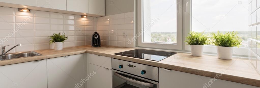 Wooden worktops and white cupboards