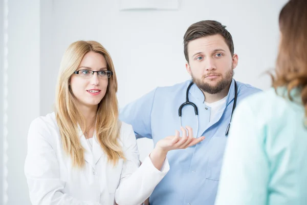Doctors in a hospital consulting — Stock Photo, Image