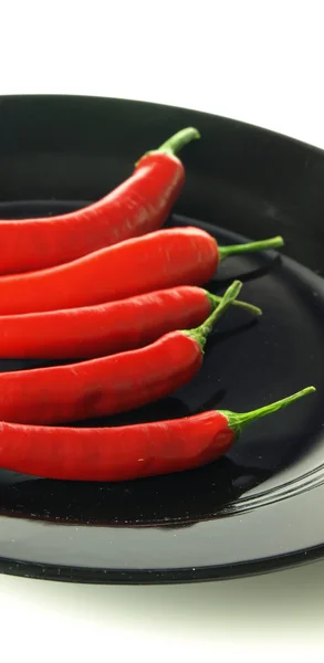 Chiles en plato negro — Foto de Stock