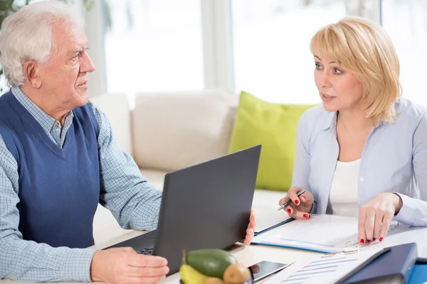 Couple consulting work issues — Stock Photo, Image