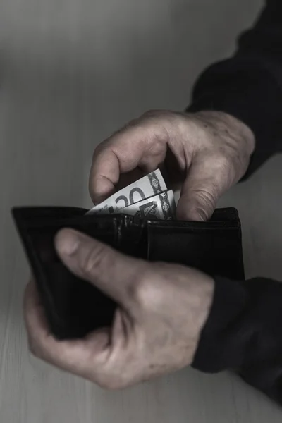 Holding wallet with money — Stock Photo, Image