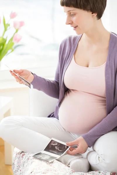 Woman admiring ultrasound image — Stock Photo, Image