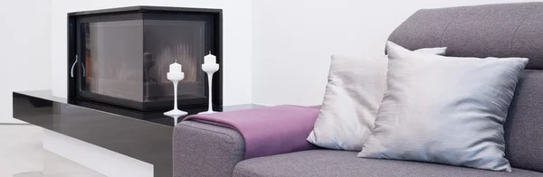 Fireplace next to the couch — Stock Photo, Image