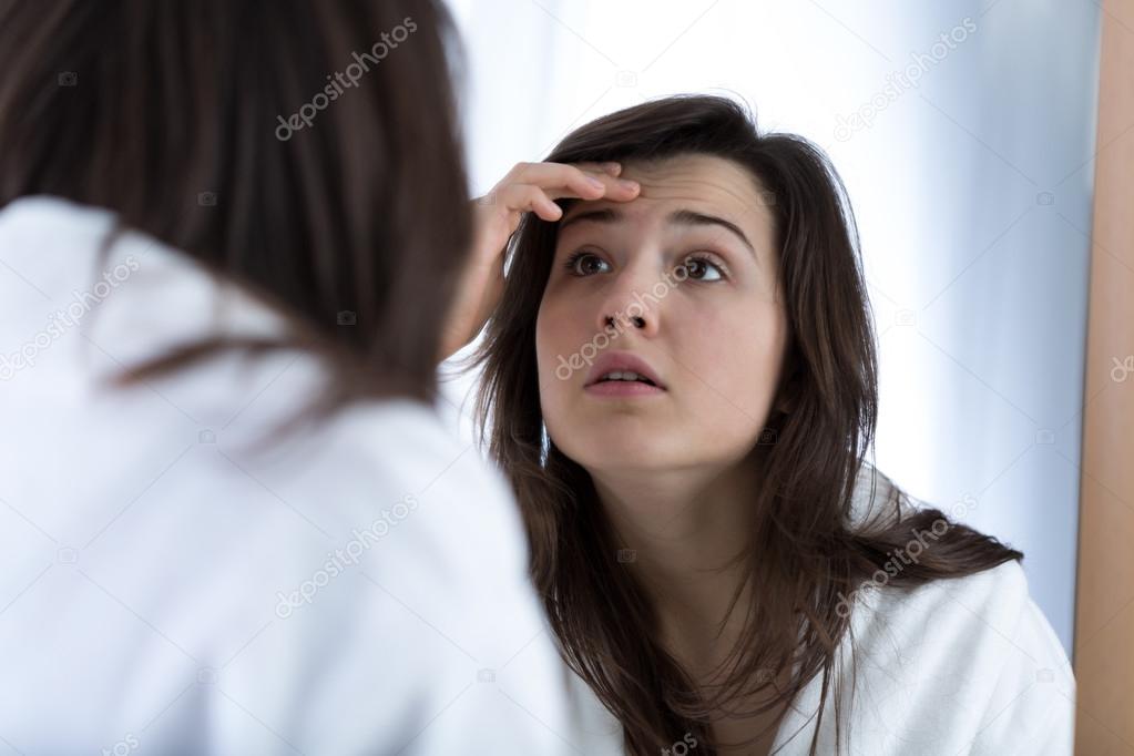 Girl looking in the mirror