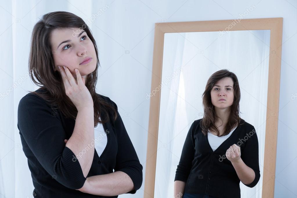 Young woman masking her emotions