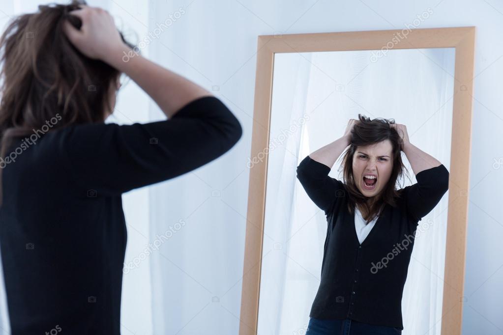 Looking at the mirror and shouting