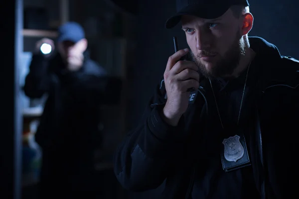 Policeman calling for back up — Stock Photo, Image