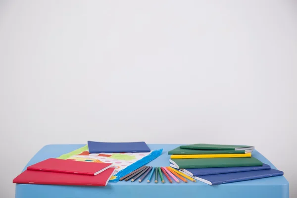 Child's picture on blue table — Stock Photo, Image