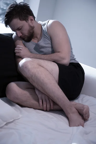 Depressed man trying to sleep — Stock Photo, Image