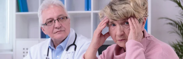 Worried woman with headache — Stock Photo, Image