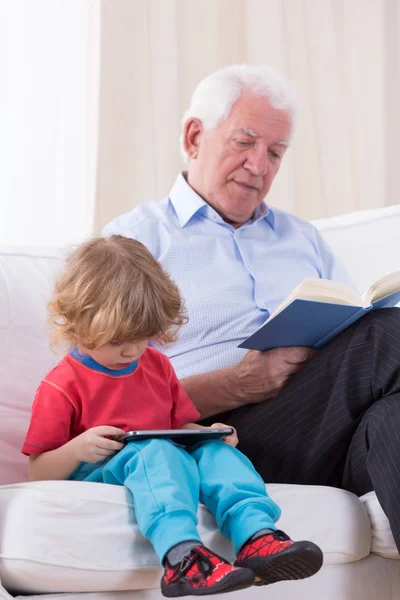 Grandfather reading book — Stock Photo, Image