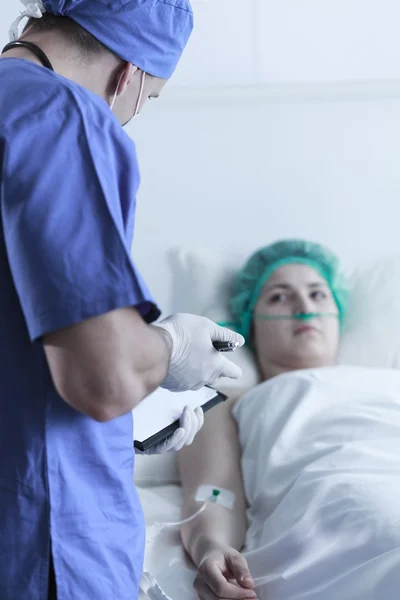 Woman lying after operation — Stock Photo, Image