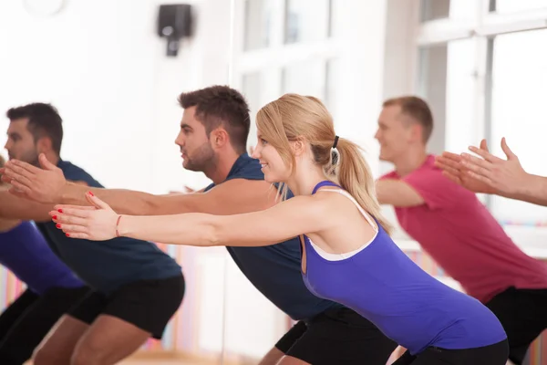 Young happy people during aerobics training — Stock Photo, Image