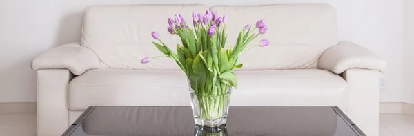 Violet flowers on the table — Stock Photo, Image