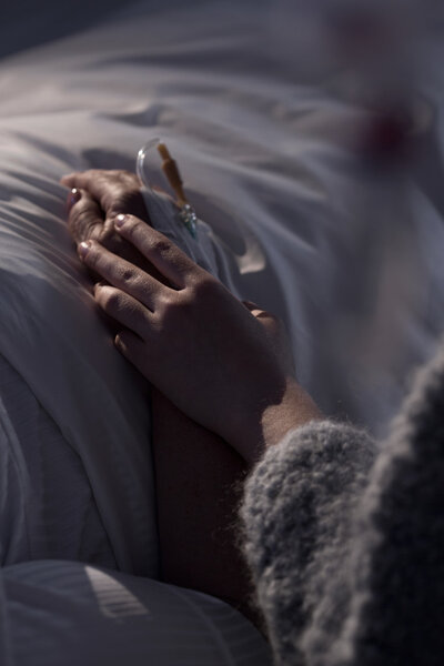 woman holding her grandma's hand