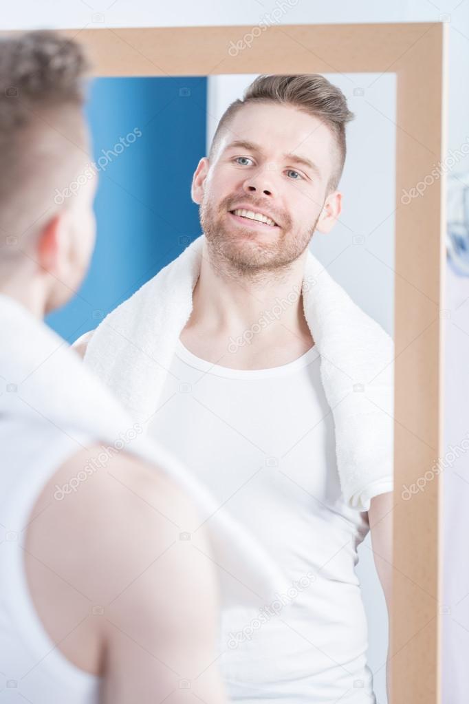 man Looking in mirror