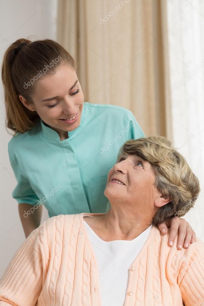 Professional carer nursing senior lady