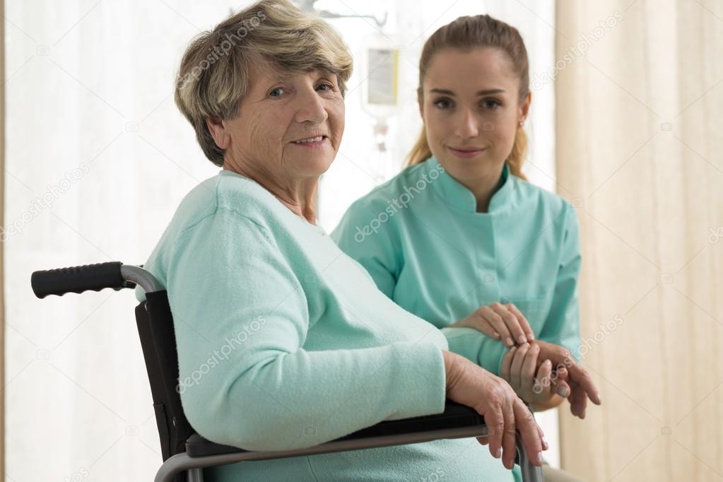 Nurse caring about senior lady