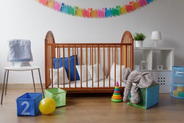 Toys in modern baby bedroom  clipart