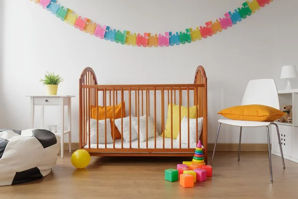 Newborn bedroom with wooden crib — Stock Photo, Image