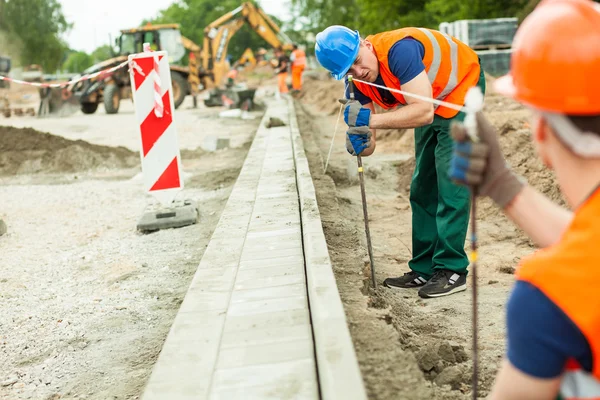 Tired road construction worker — Stock Photo, Image