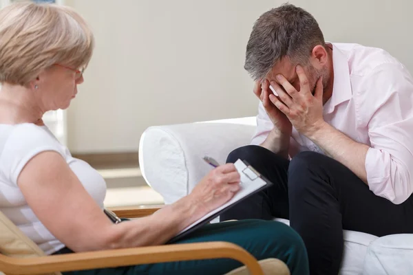 Despair young male with therapist — Stock Photo, Image