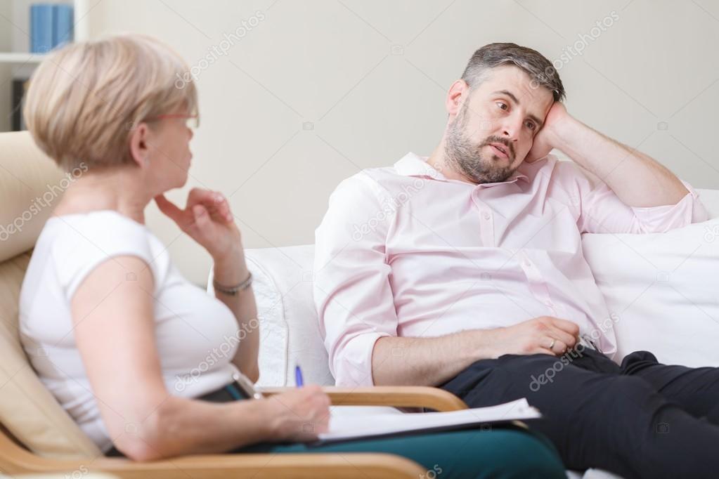 Psychologist helping man with depression